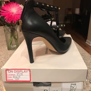 Black heels with gold accents